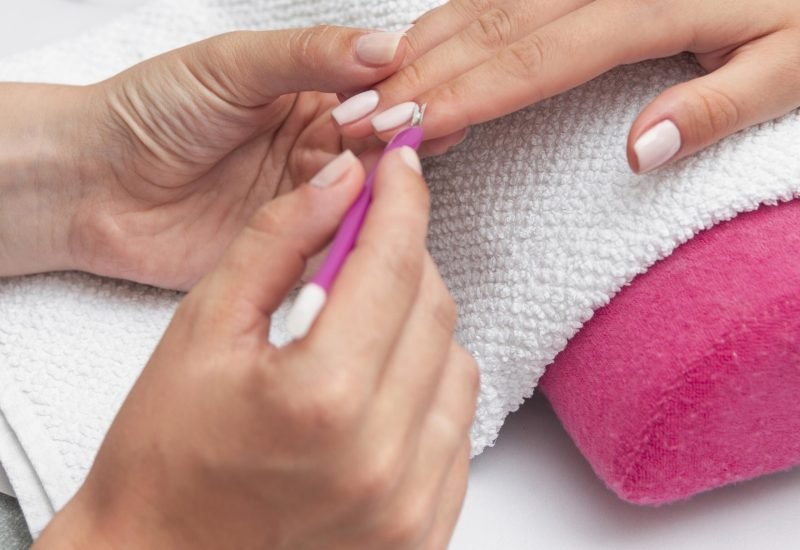 woman-doing-her-manicure-salon-close-up woman-doing-her-manicure-salon-close-up